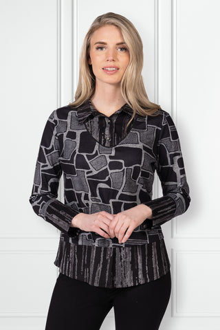 Black and grey collared top with abstract print and layered contrast hem