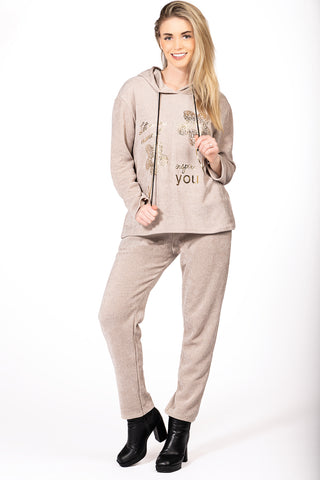 Relaxed drawstring pants styled with a matching hooded top