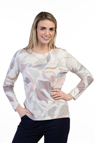 Model wearing an abstract print long-sleeve sweater with a rounded neckline