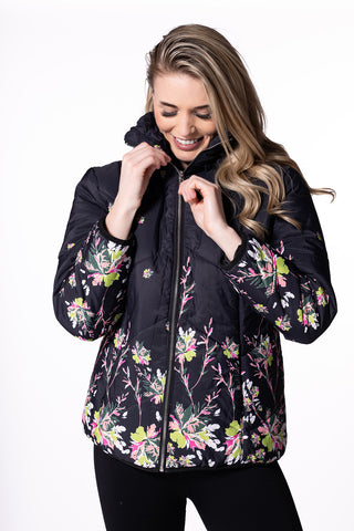 Model wearing a floral print quilted puffer jacket with a raised collar and front zipper